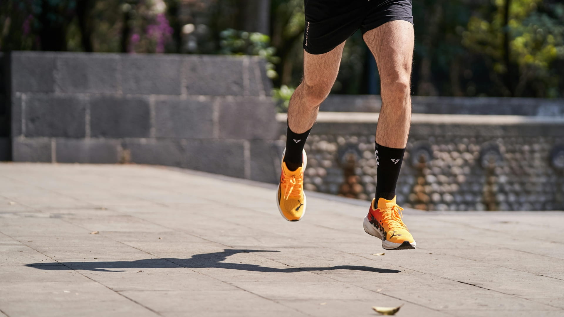 Feet in the air, mid-step, during a run