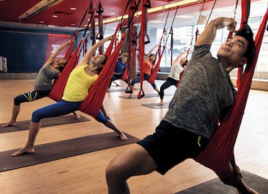 Aerial flow yoga class.